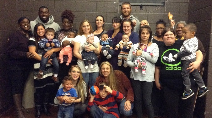 Delanie Walker posing with members of the community center