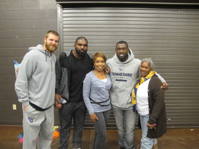 Walker poses with community members