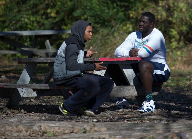 William Hayes talking to a teen