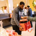 Bobby Wagner packing up thanksgiving meals